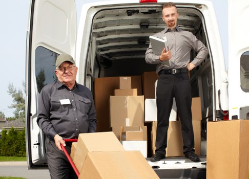 Removal crew packing and protecting furniture for a home move