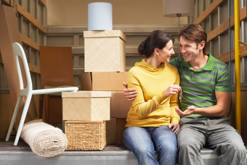 Flat removals in Vauxhall showing careful handling in a modern apartment building
